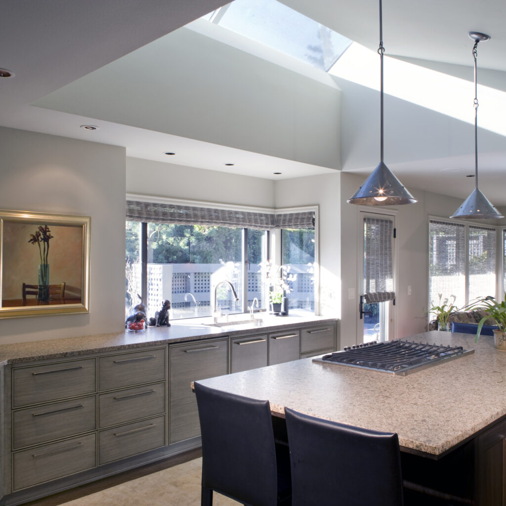 kitchen, pendant light, skylight, island, granite counter